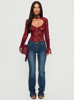 side view of model wearing Princess Polly Giallo Long Sleeve Bodysuit Burgundy Long Sleeve Tops 