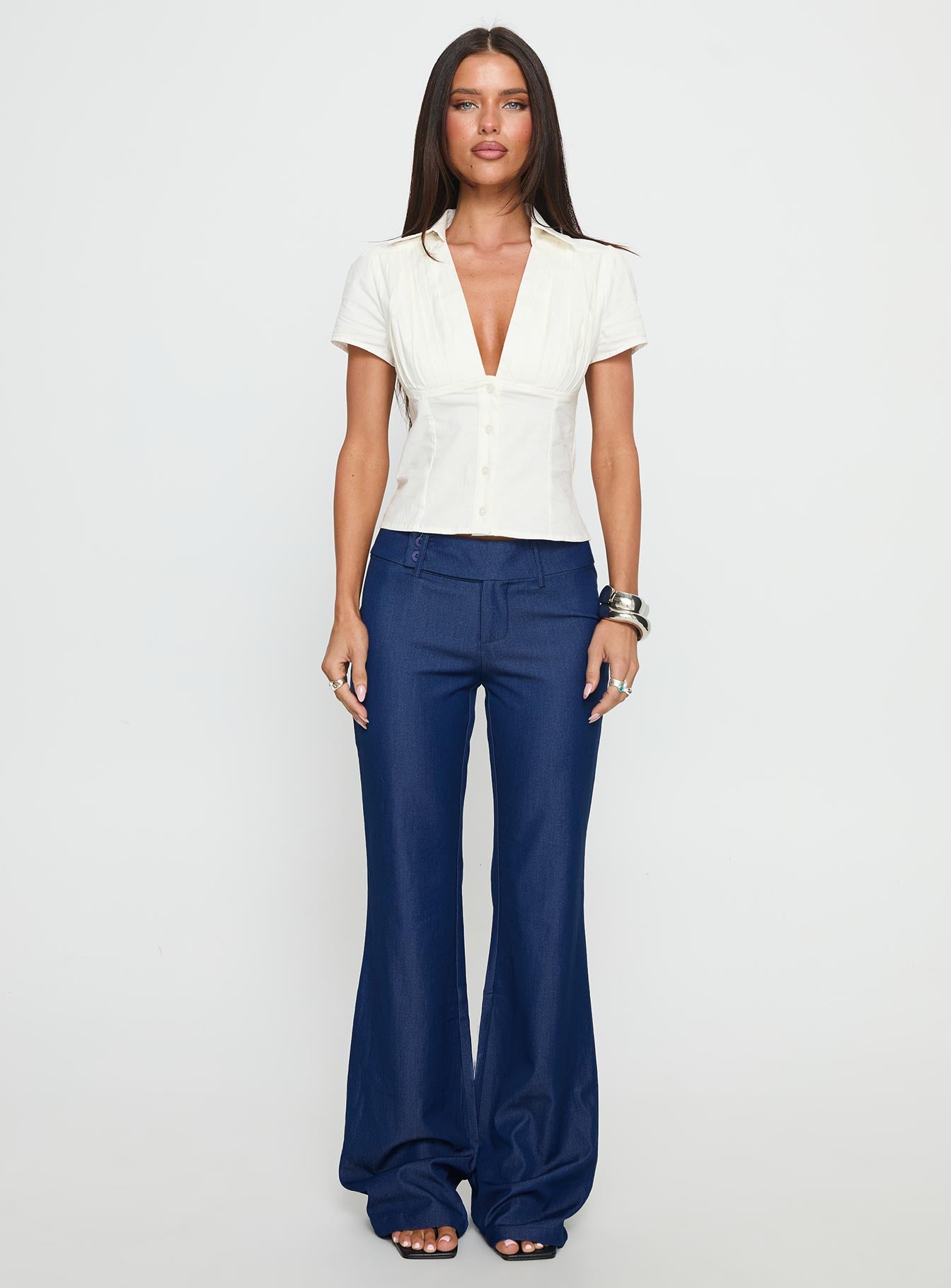 front view of model wearing Princess Polly Kinkirk Flared Pants Chambray Mid Rise Pants 