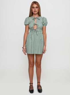 side view of model wearing Princess Polly Nurture Bow Mini Dress Green Stripe Crew Neck 