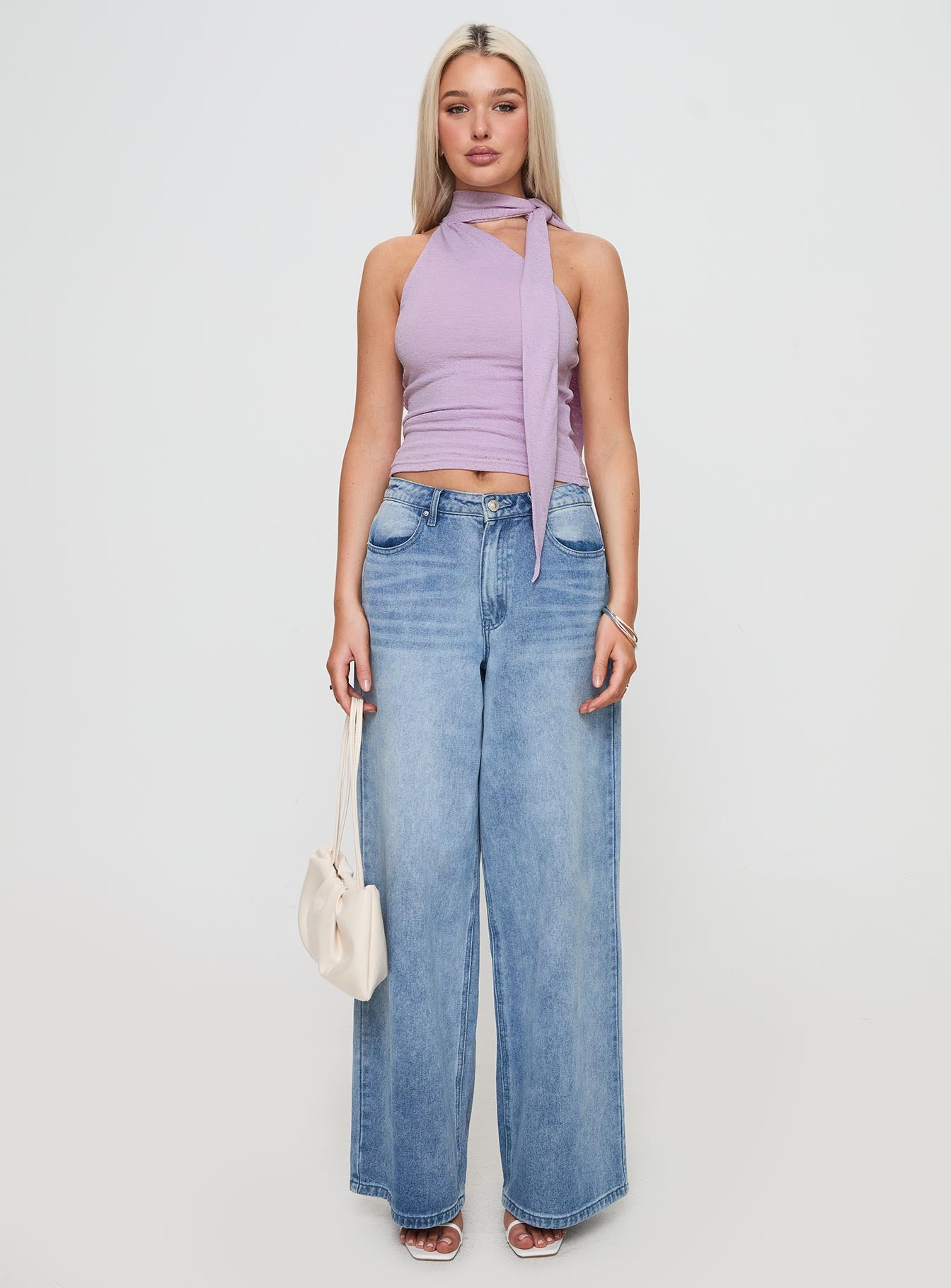 side view of model wearing Princess Polly Anderstone Neck Tie Top Purple Sleeveless Asymmetric Neckline 