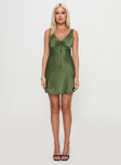 side view of model wearing Princess Polly Kosettina Mini Dress Green V-Neck 