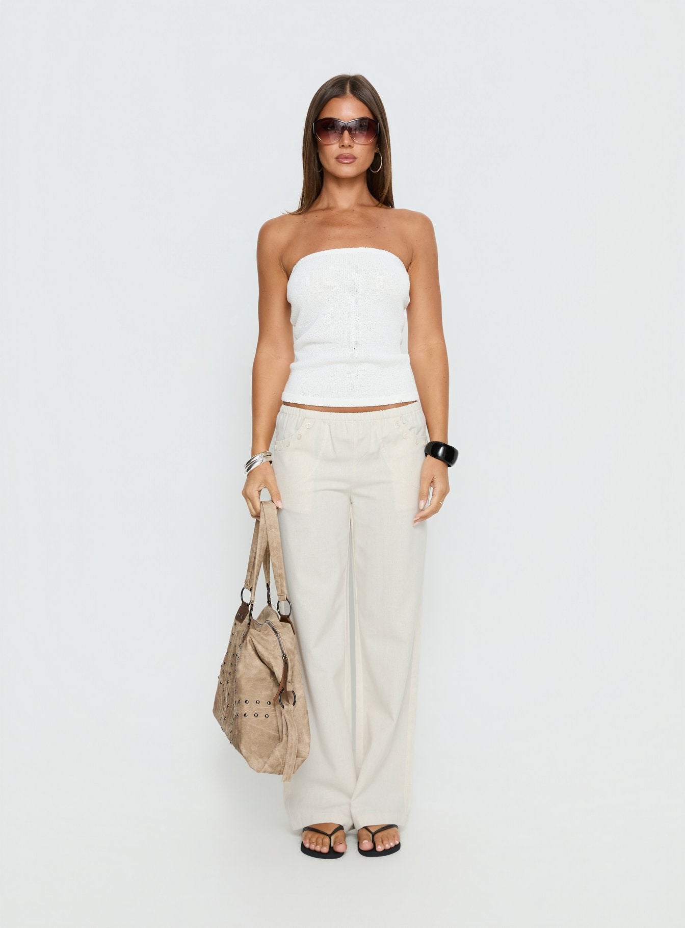 front view of model wearing Princess Polly Around The Clock Button Detail Mid Rise Wide Leg Pants Cream Mid Rise Pants 