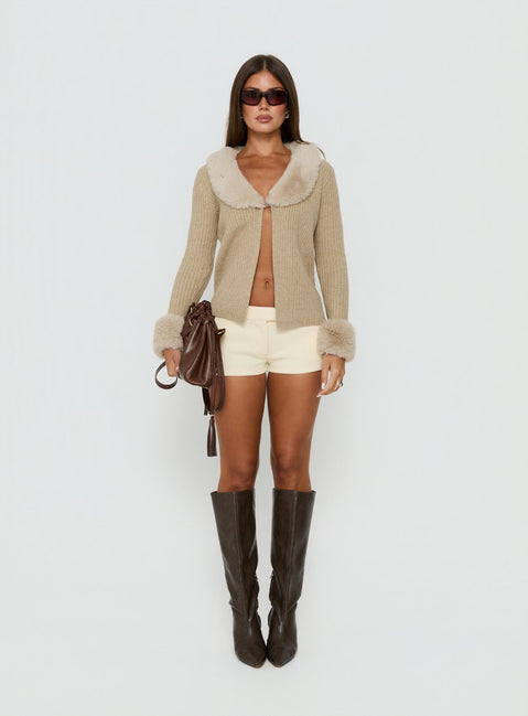 Showcasing the Gisele Faux Fur Trim Long Sleeve Sand womens jumper with short length front view of model wearing Princess Polly