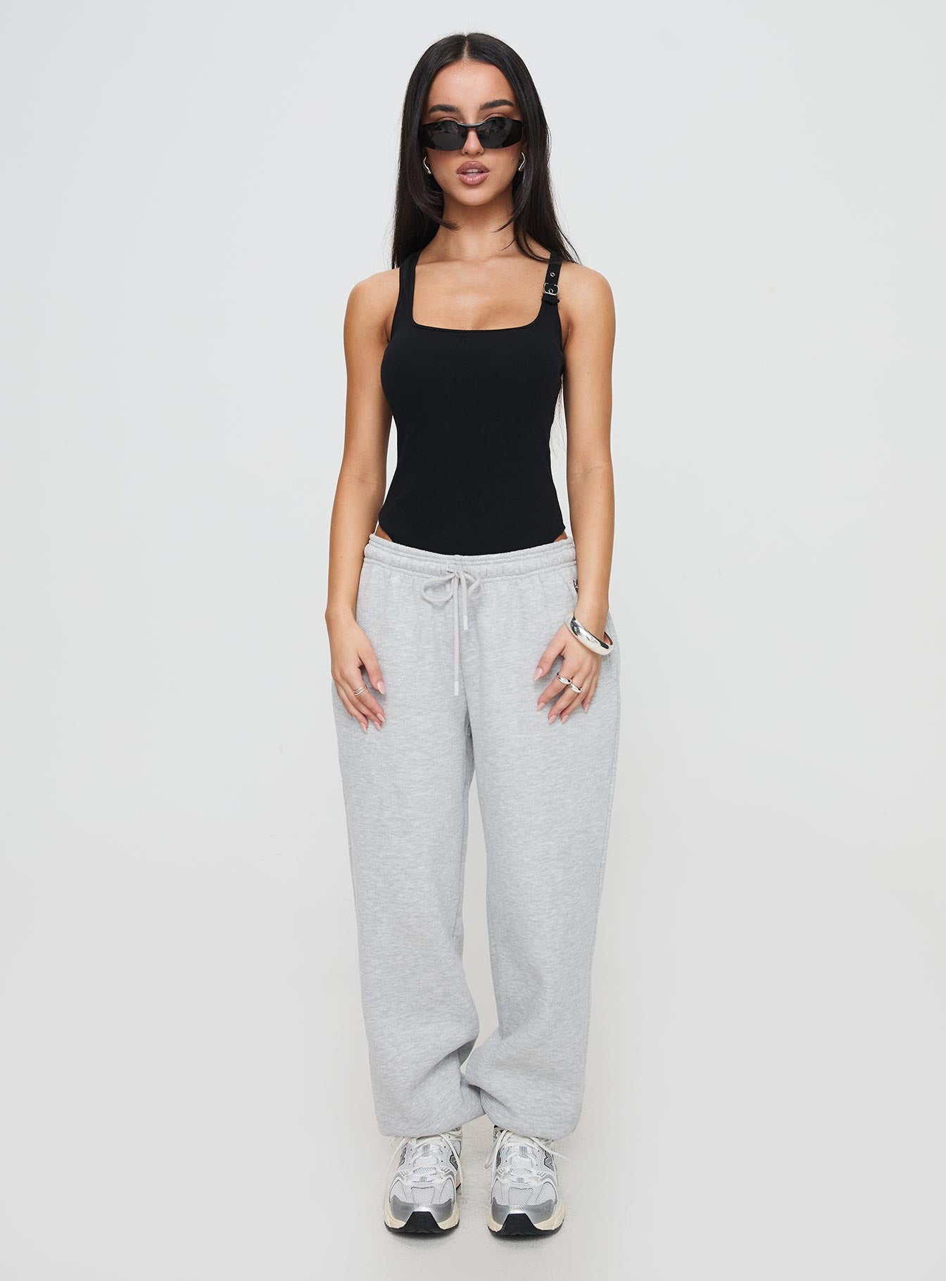 back view of model wearing Princess Polly Novelle Bodysuit Black Sleeveless Square Neck 