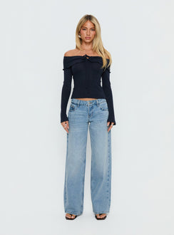 front view of model wearing Princess Polly Ellanor Low Rise Slouch Denim Jean Washed Mid Blue Wash Low Rise Jeans 