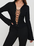 front view of model wearing Princess Polly Alexandar Long Sleeve Top Black Full Sleeves V-Neck 