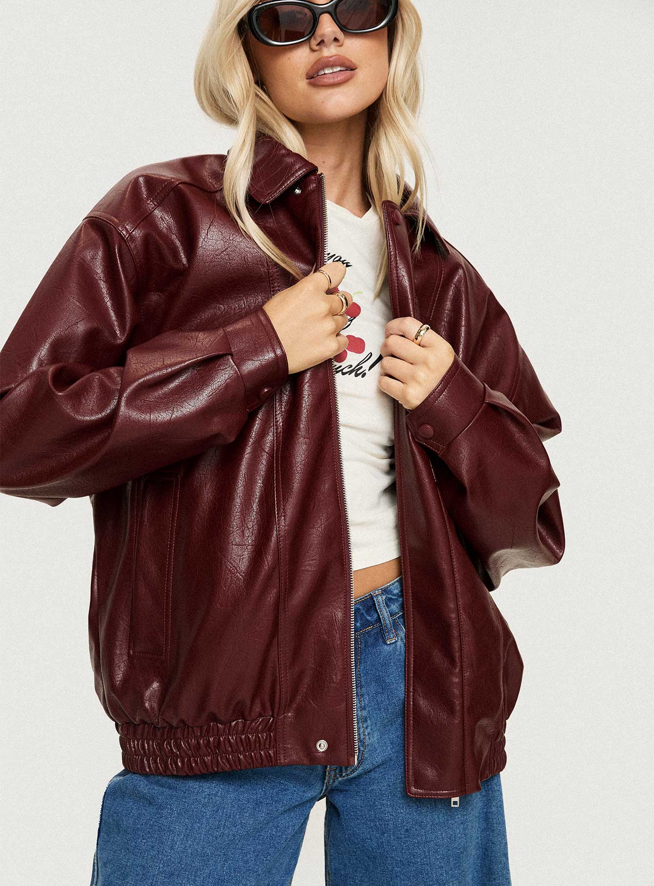 Burgundy Faux Leather jacket Oversized fit, zip fastening at front, classic collar, twin hip pockets, elasticated waistband