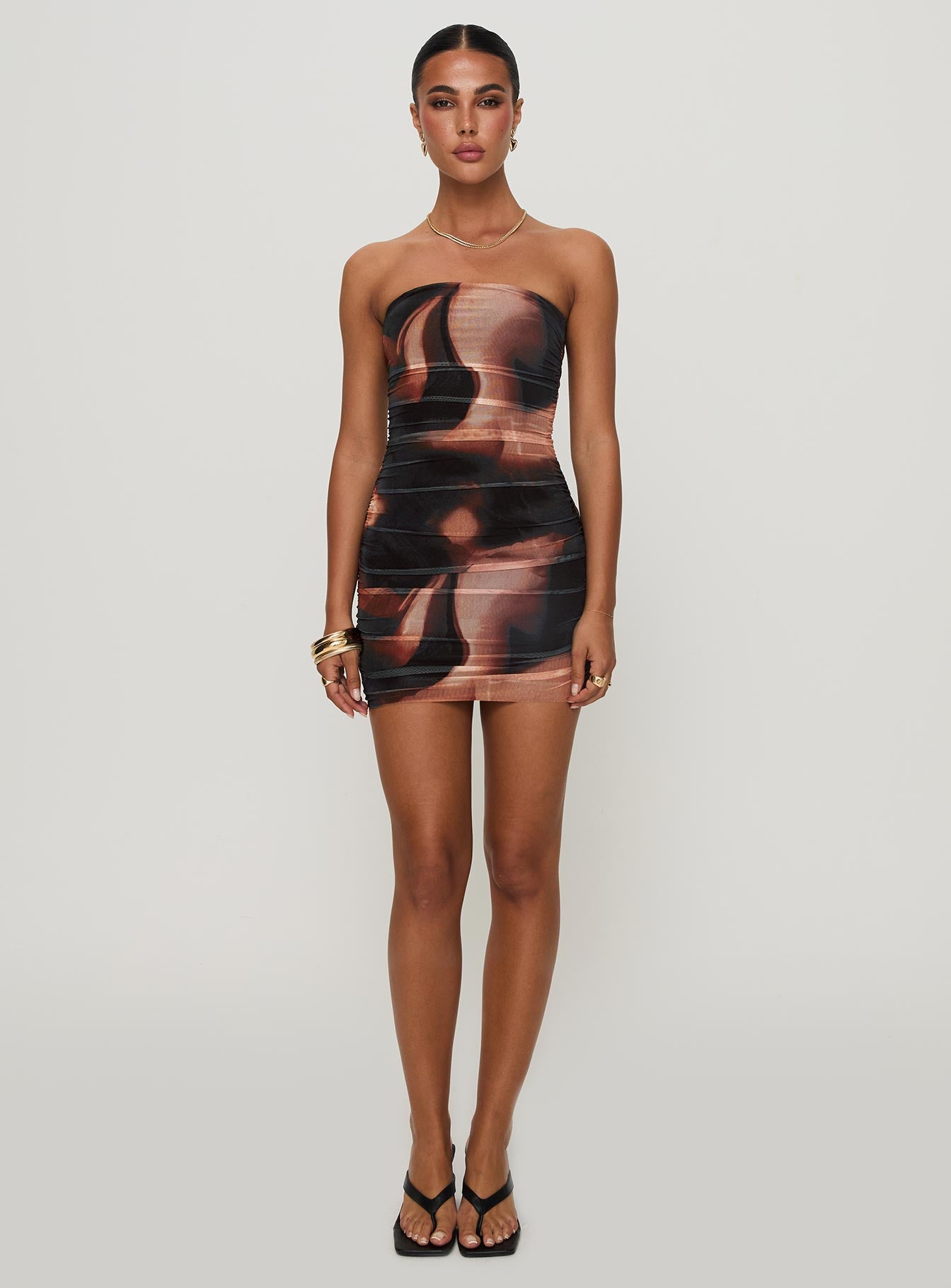 side view of model wearing Princess Polly Micah Mini Dress Brown Multi Straight Neck 