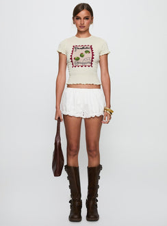 side view of model wearing Princess Polly Ciao Bella Shirred Graphic Top Cream Short Sleeves Crew Neck 