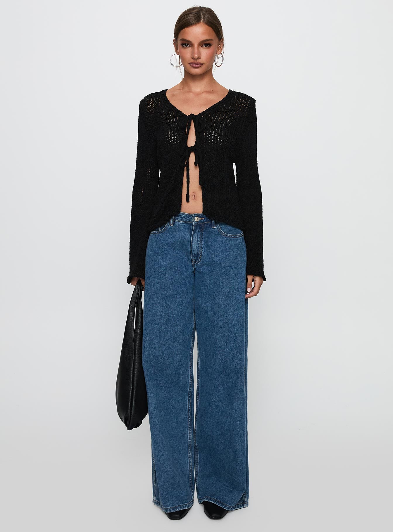 side view of model wearing Princess Polly Swain Knit Cardigan Black Cropped Jumpers 