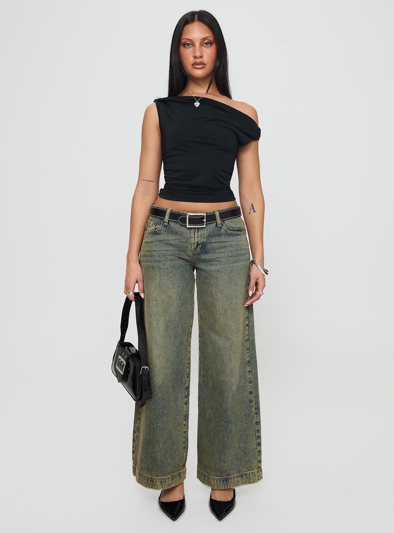 front view of model wearing Princess Polly Alckie Top Black Sleeveless Asymmetric Neckline 