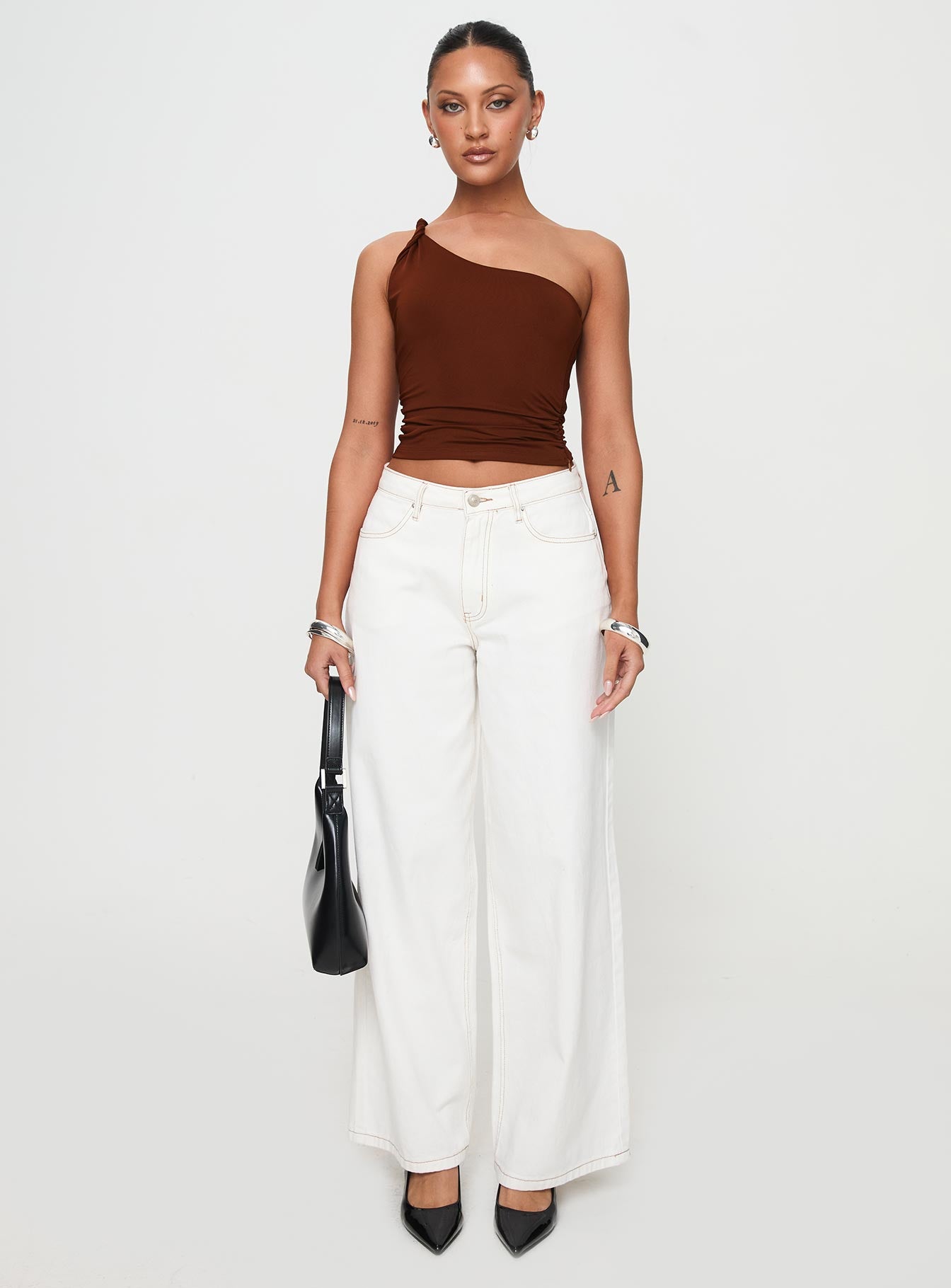 front view of model wearing Princess Polly Anwen Top Brown Sleeveless Asymmetric Neckline 