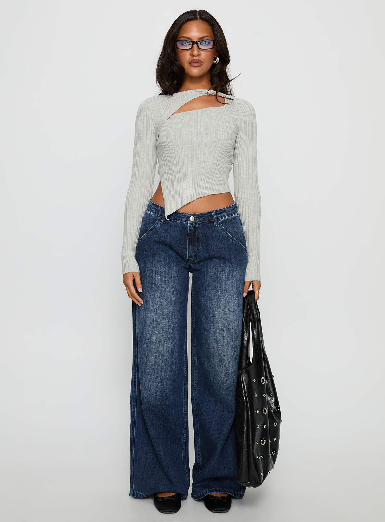 front view of model wearing Princess Polly Downtowner Low Rise Cargo Jeans Mid Blue Wash Low Rise Jeans 