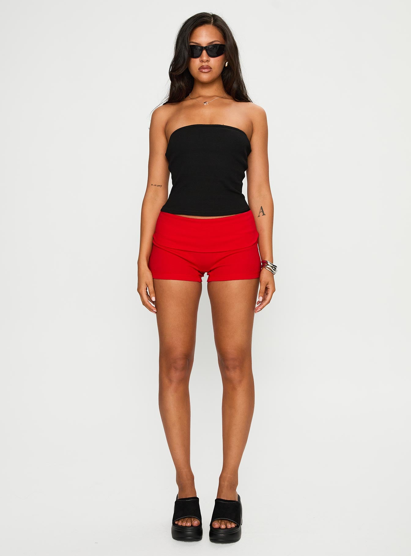 front view of model wearing Princess Polly Baseline Low Rise Rib Shorts Red Low Rise Shorts 