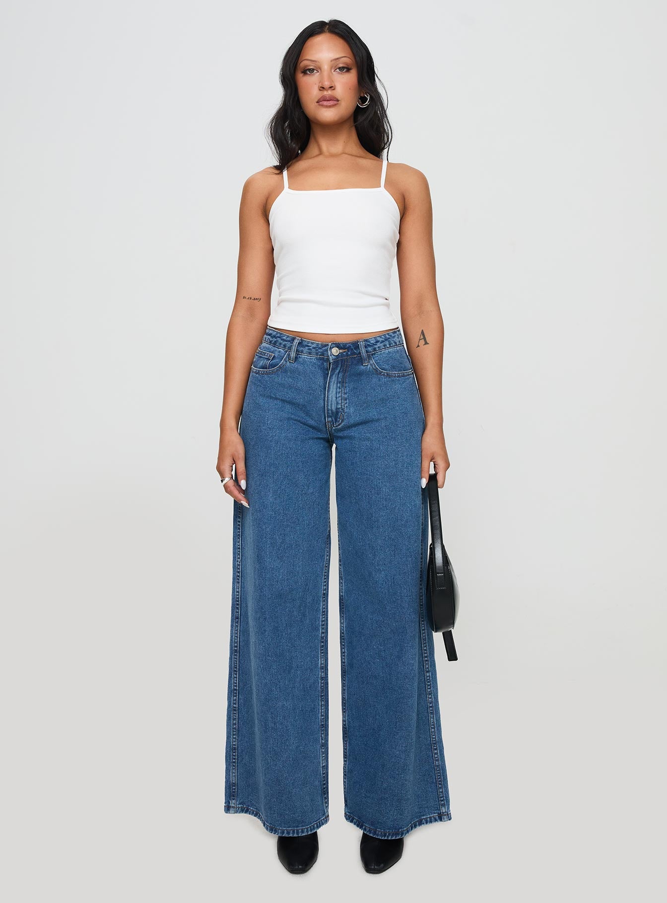 front view of model wearing Princess Polly Baseline Rib Top White Sleeveless Square Neck 