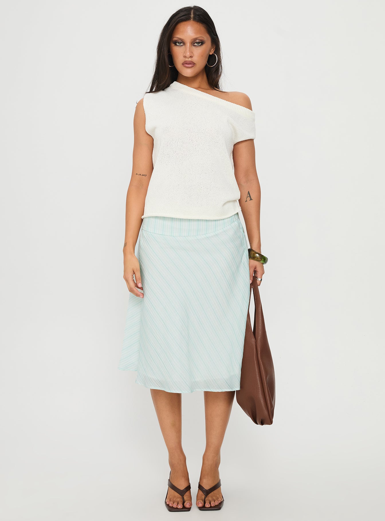   side view of model wearing Princess Polly Alunara Midi Skirt Aqua Stripe Midi Skirts 