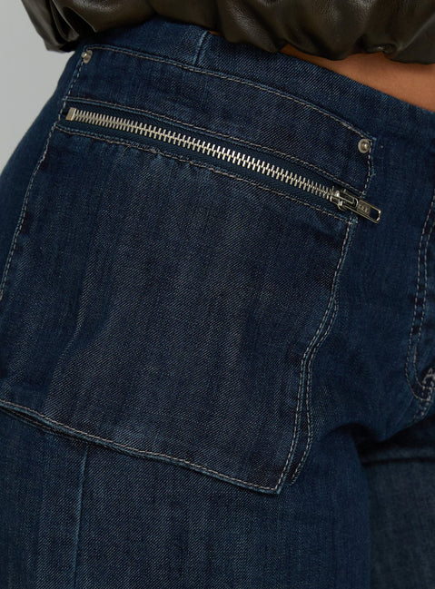 back view of model wearing Princess Polly Paltrow Mid Rise Wide Leg Cargo Jeans Dark Blue Wash Mid Rise Jeans 