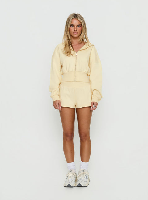 side view of model wearing Princess Polly Daytime Cropped Blouson Hoodie Buttercream Cropped Jumpers 