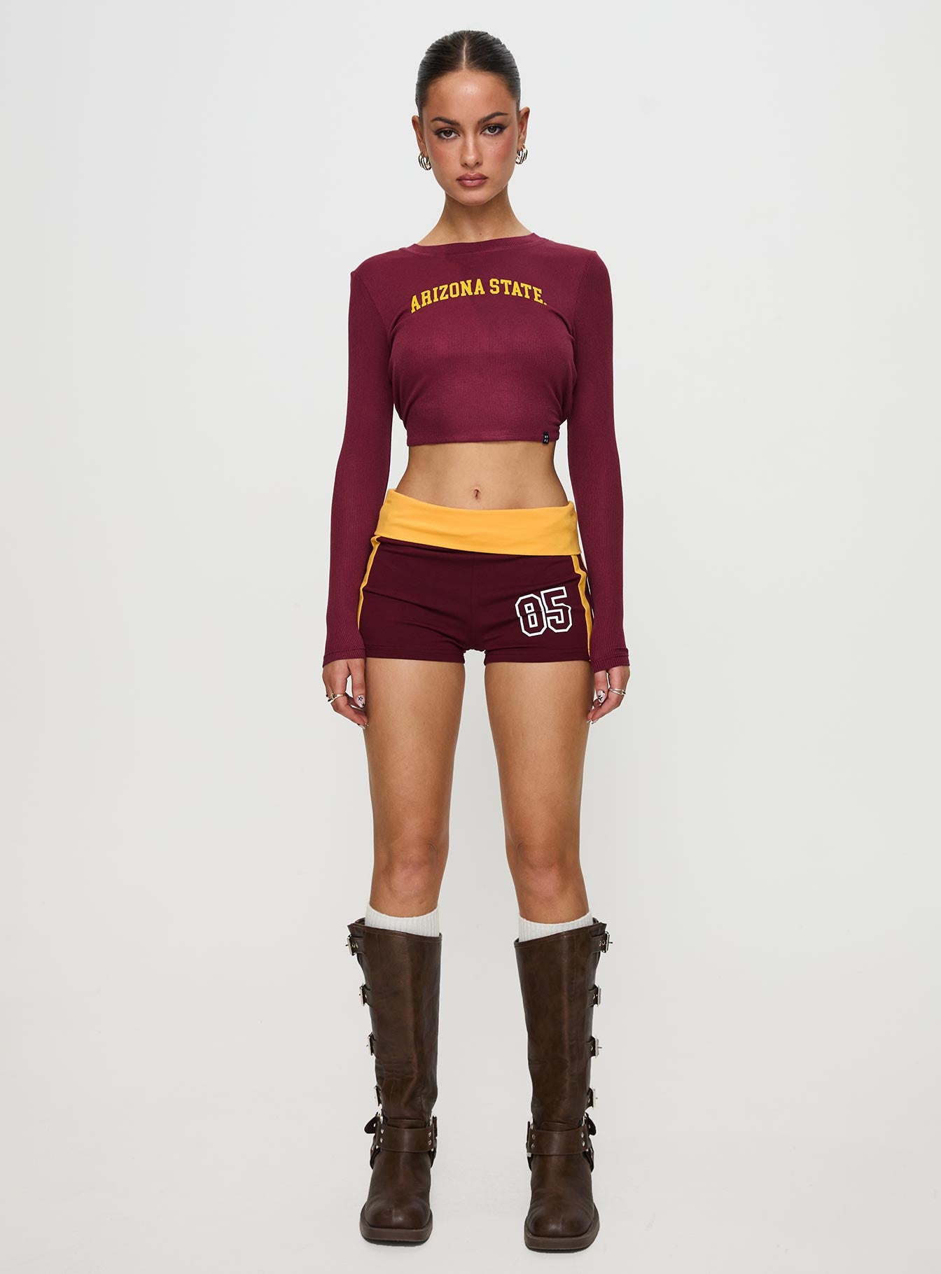 front view of model wearing Princess Polly ASU Foldover Shorts Maroon Low Rise Shorts 