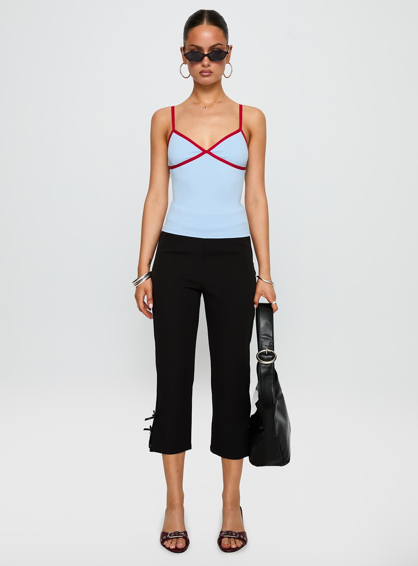 front view of model wearing Princess Polly Tiera Top Blue / Red Sleeveless V-Neck 