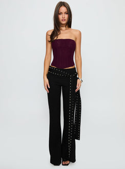 side view of model wearing Princess Polly Nikolia Studded Wrap Belt Pants Black Mid Rise Pants 