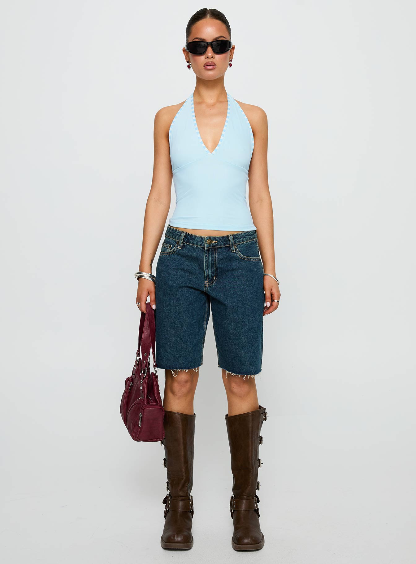 side view of model wearing Princess Polly Mirabelle Top Blue Sleeveless Plunger 