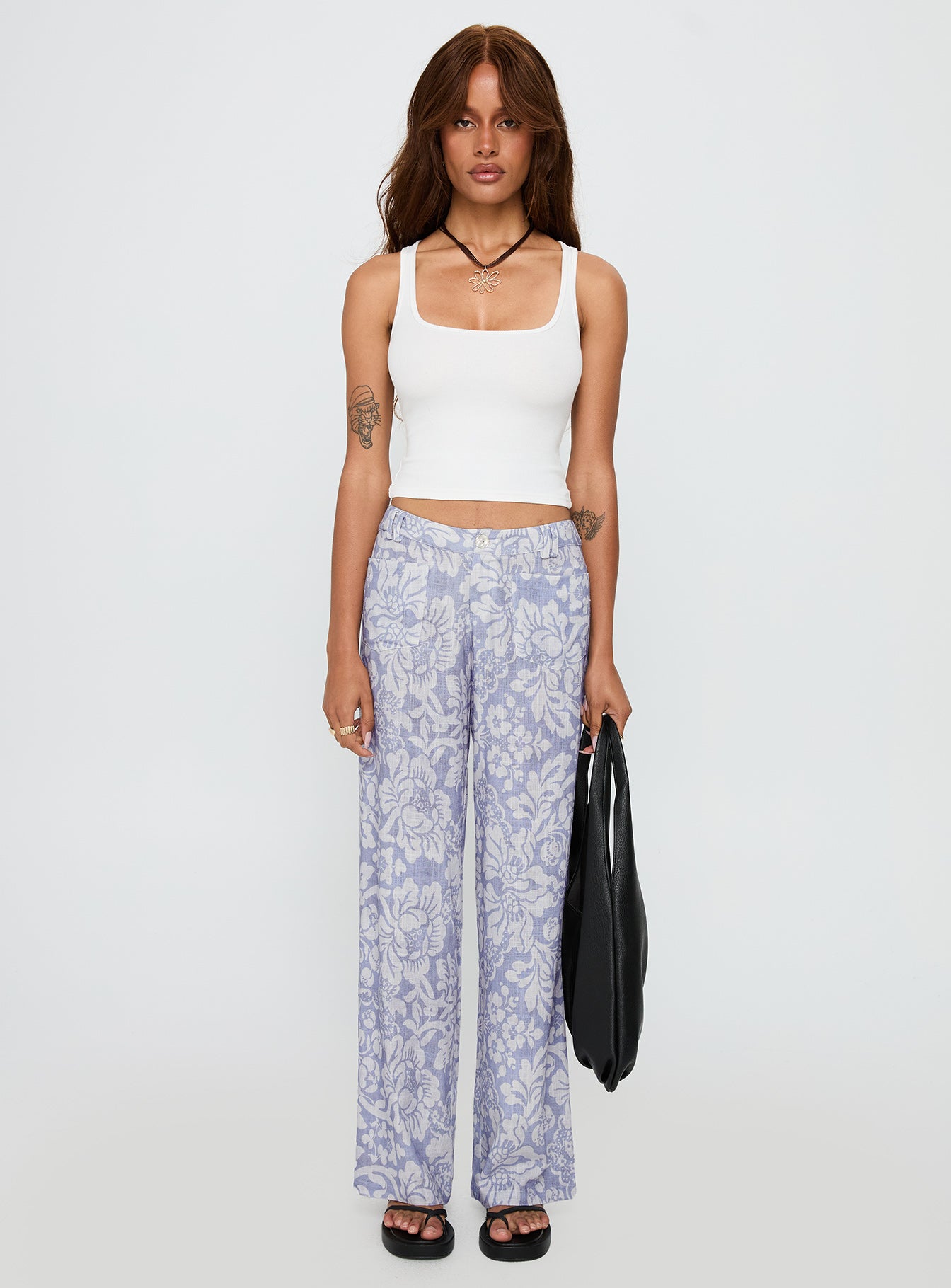 front view of model wearing Princess Polly Vendi Low Rise Pant Lilac Floral Low Rise Pants 