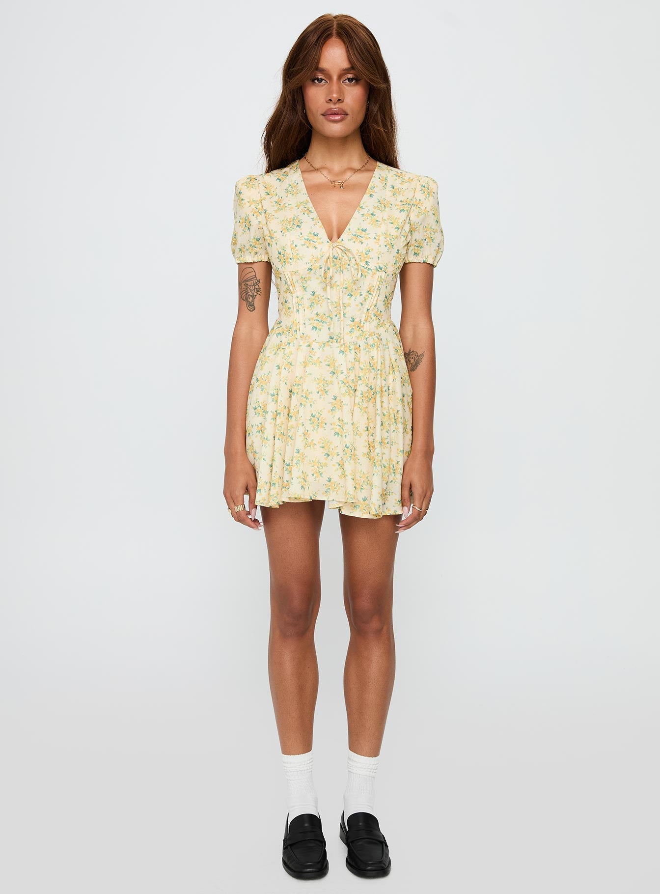 front view of model wearing Princess Polly Ethelyn Mini Dress Yellow Floral V-Neck 