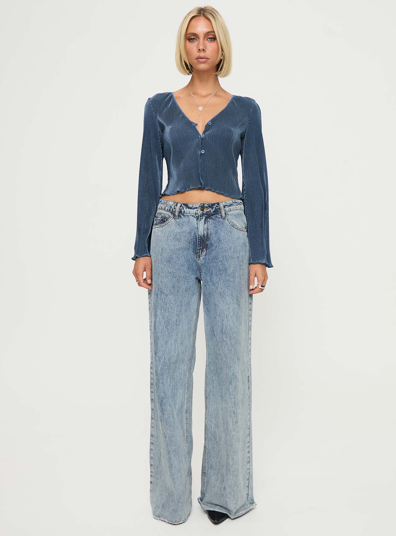 front view of model wearing Princess Polly Collis Long Sleeve Top Blue Full Sleeves V-Neck 