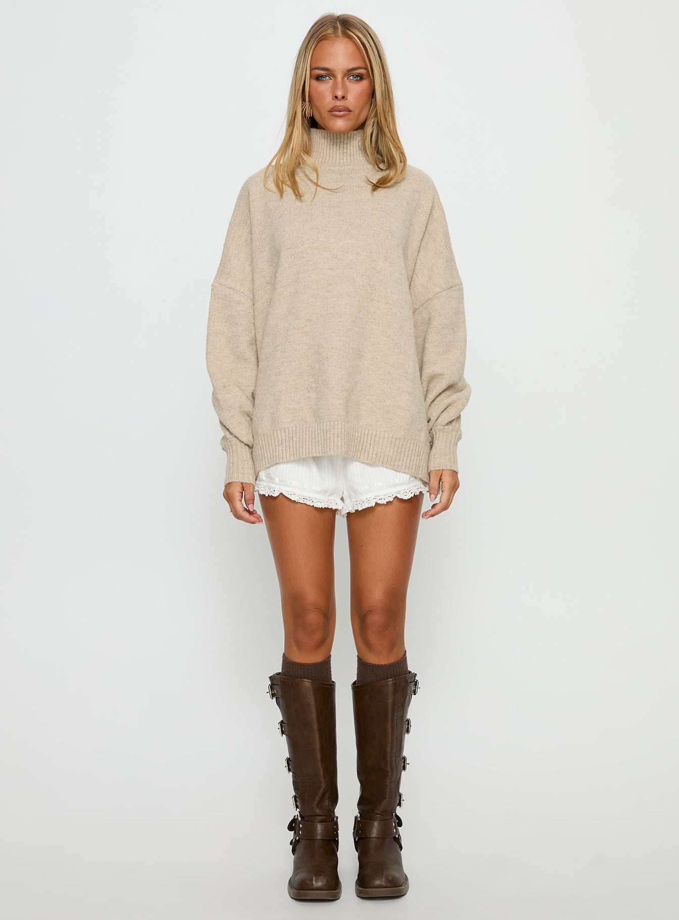 side view of model wearing Princess Polly Patrizia Funnel Neck Knit Sweater Beige 