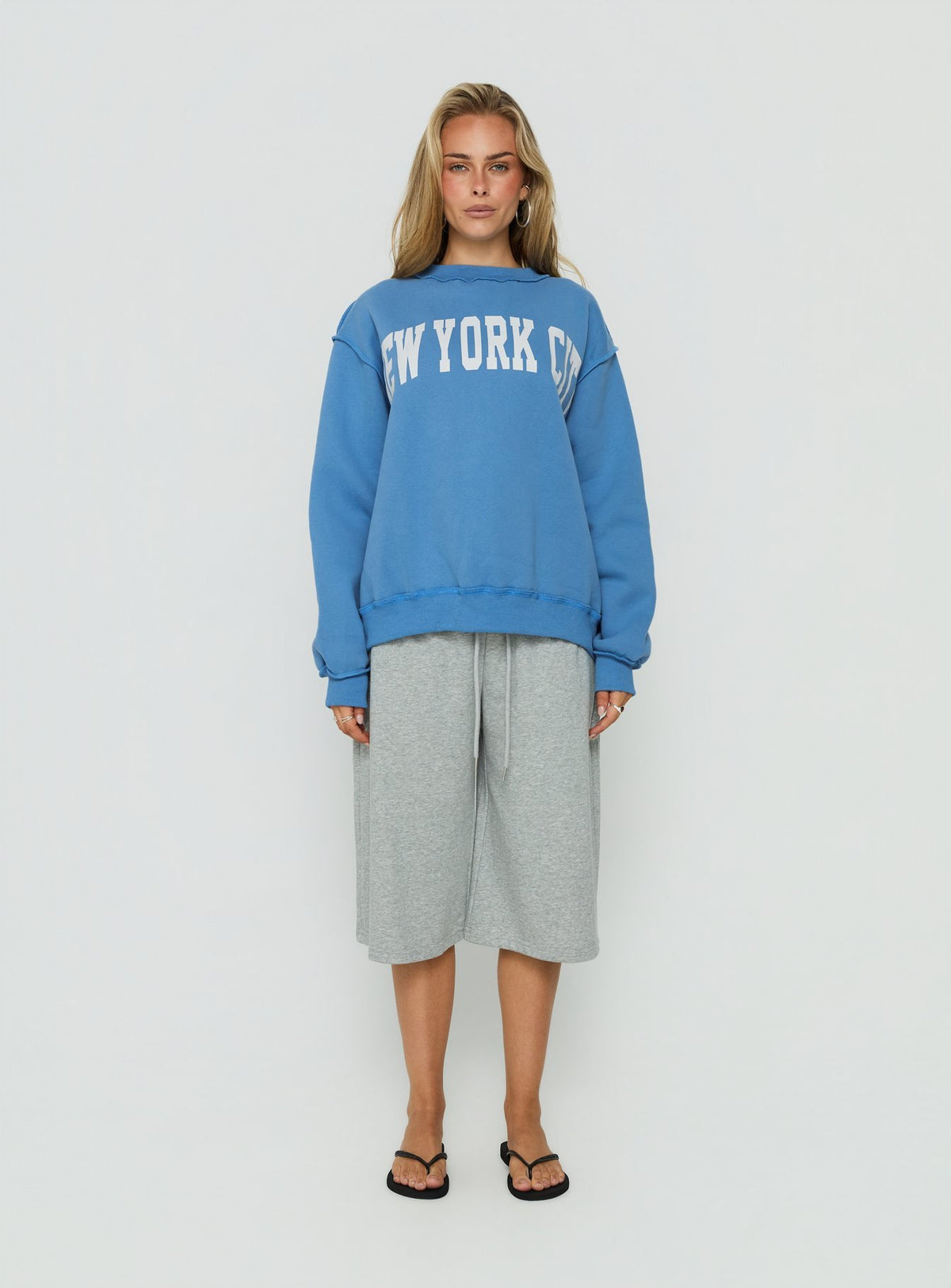 Featuring the When In New York City Oversized Jumper Blue womens jumper with long fit on-body Princess Polly