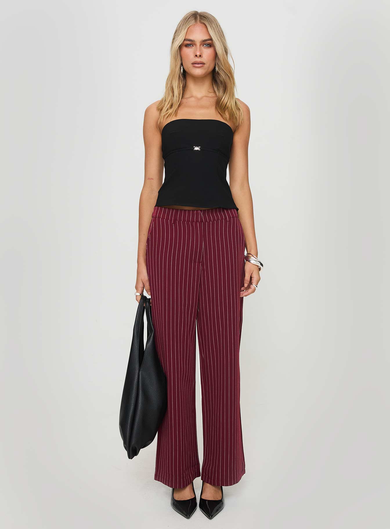 side view of model wearing Princess Polly Aquaville Pants Burgundy Pinstripe High Waisted Pants 