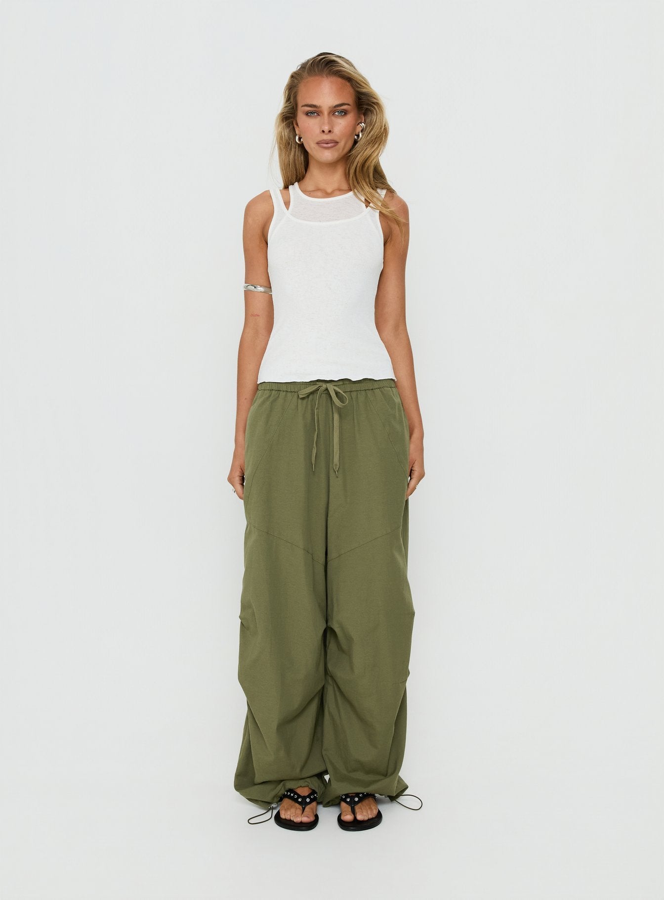 Discover the Mankind Baggy Cargo Pants Olive in womens-regular-pants with mid-rise waist front view of model wearing Princess Polly
