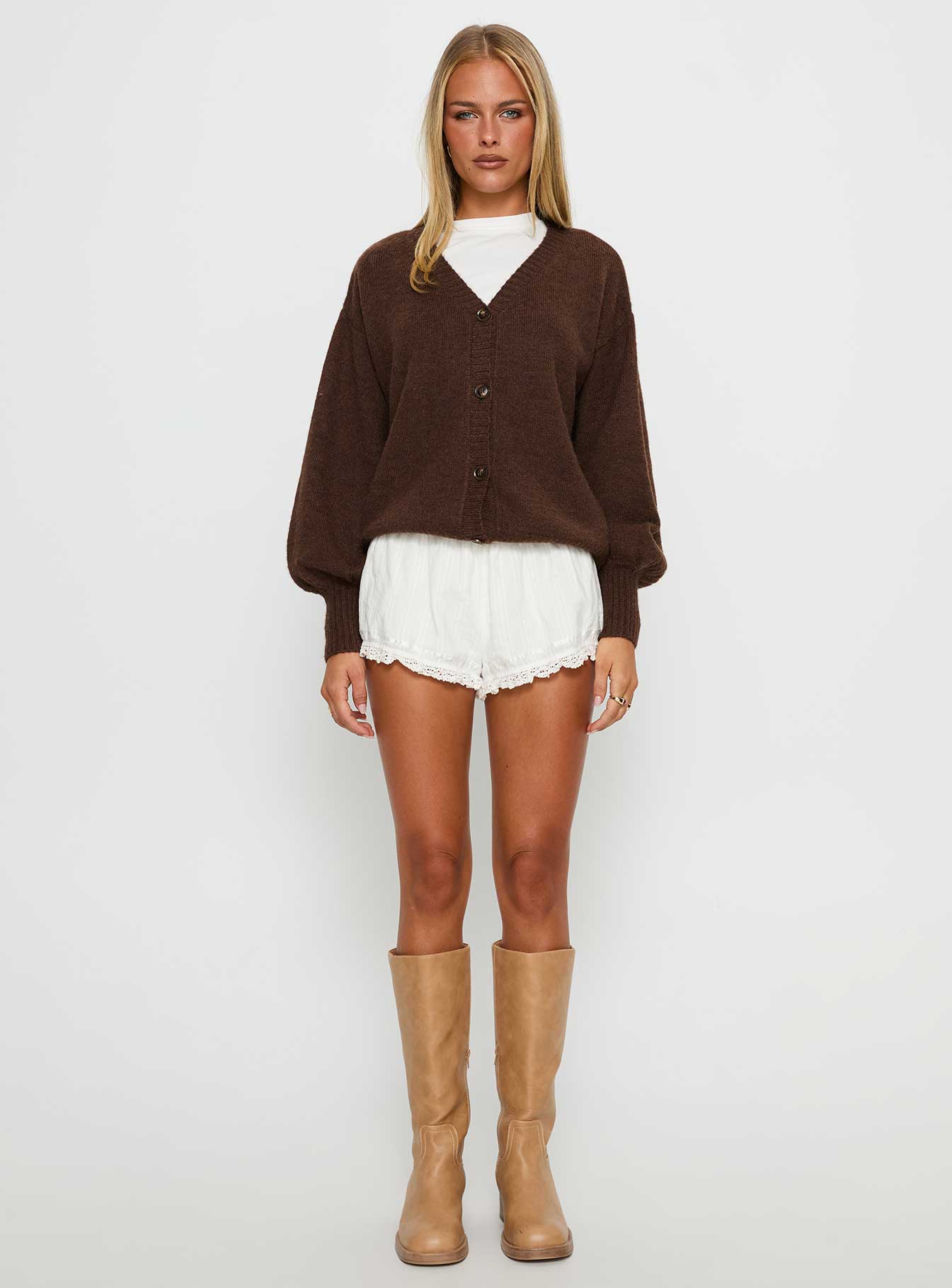 side view of model wearing Princess Polly Eartha V Neck Knit Sweater Brown Long 