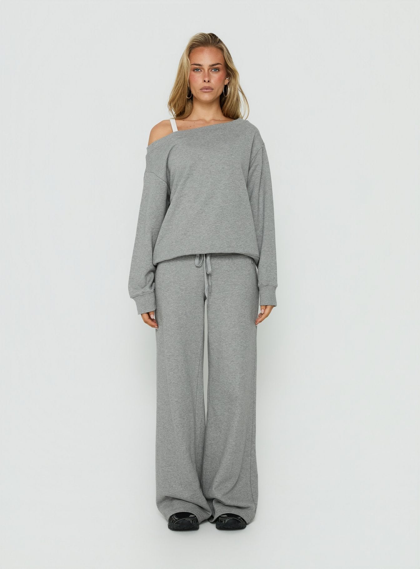 Showcasing the Dodie Wide Leg Pants Dark Grey Marle in womens-regular-pants with mid-rise front view of model wearing Princess Polly