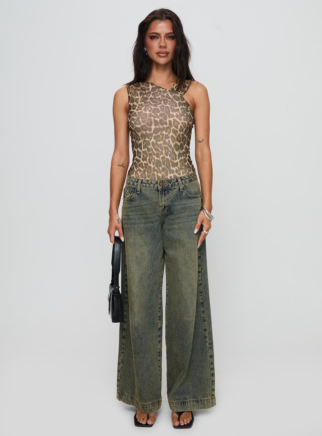 side view of model wearing Princess Polly Serenata Bodysuit Leopard Sleeveless 