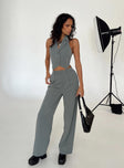 Matching set Vest top  Lapel collar  Button front fastening  High waisted pants  Zip and button fastening  Belt looped waist  Twin hip pockets  Elasticated back Wide leg 