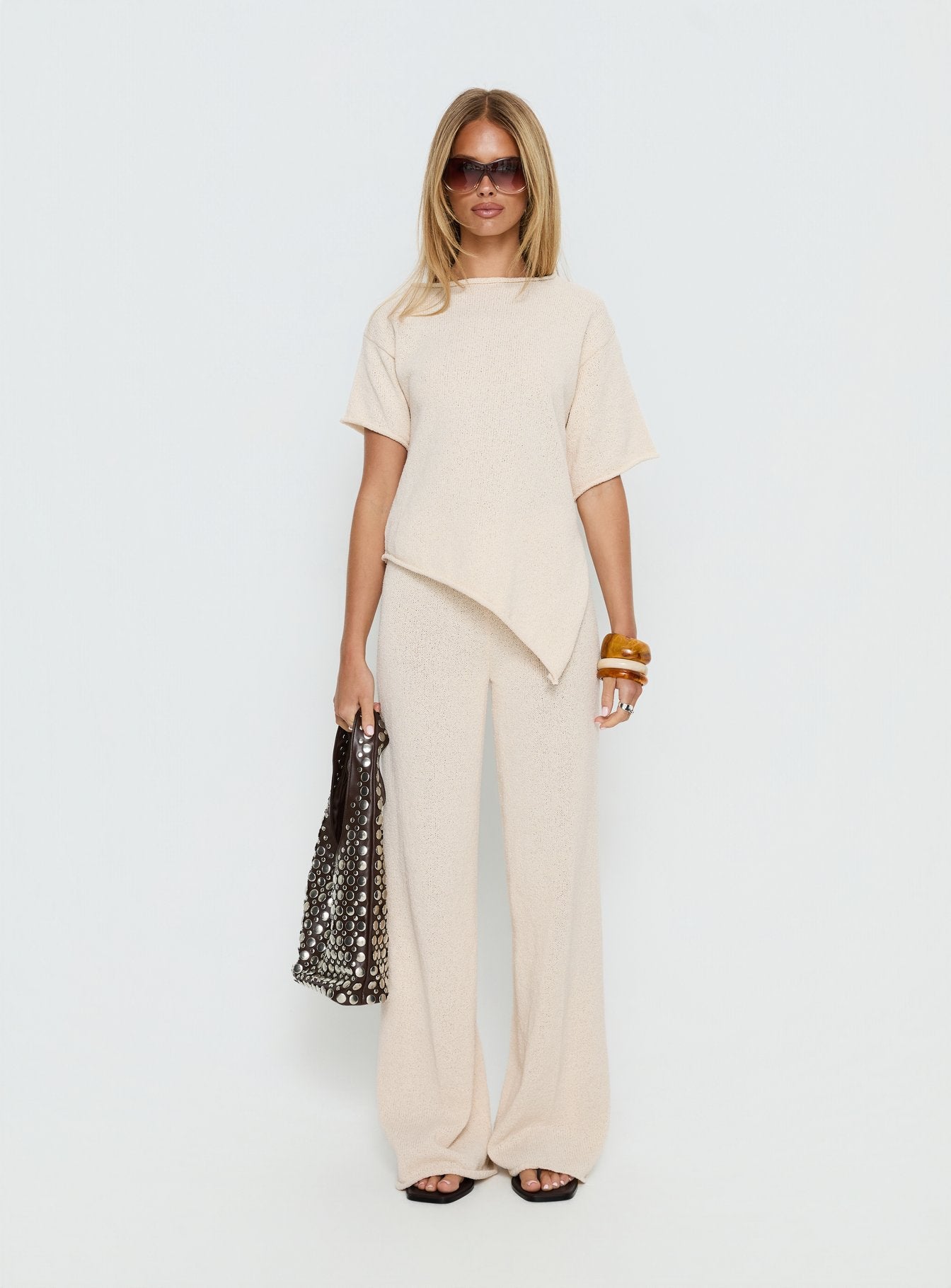 side view of model wearing Princess Polly Calisse Knit Wide Leg Pants Beige High Rise Pants 