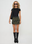 side view of model wearing Princess Polly Remington Skort Green Camo mid-rise 