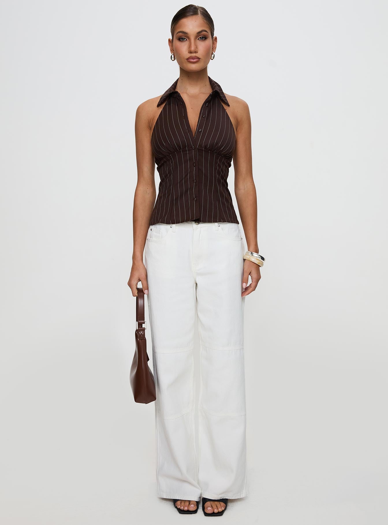 front view of model wearing Princess Polly Victorie Halter Top Chocolate Stripe Sleeveless Plunger 