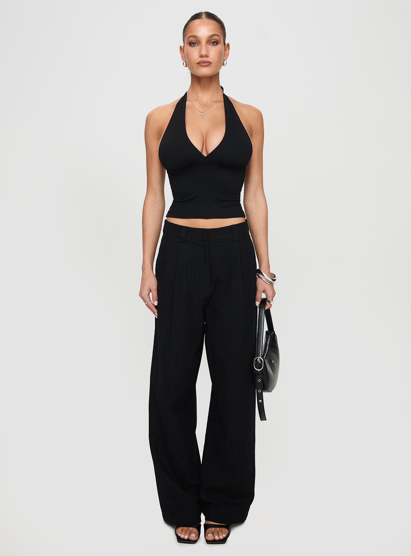 front view of model wearing Princess Polly Whimsy Halter Top Black Sleeveless Plunger 