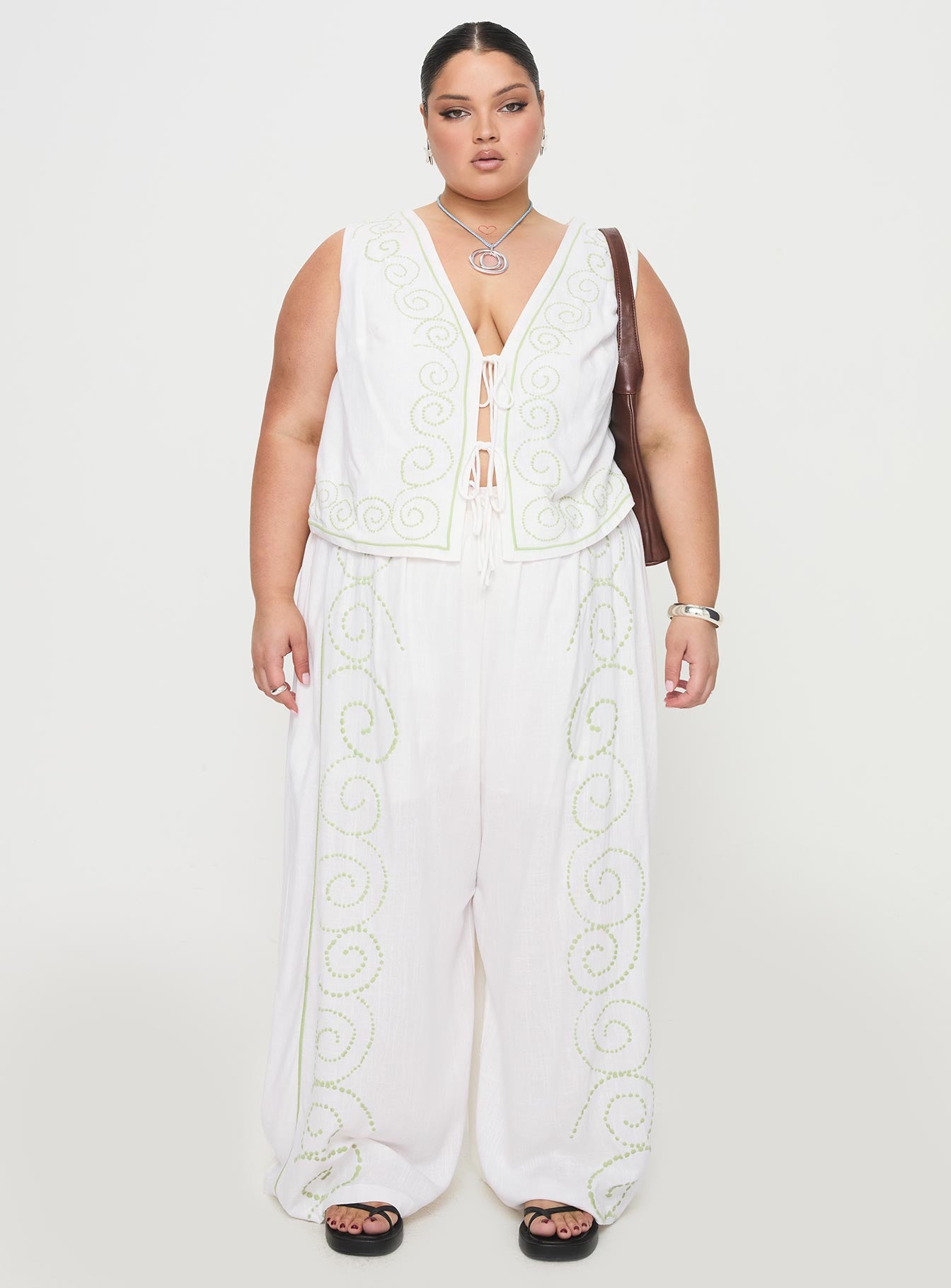 front view of model wearing Princess Polly Kindred Tie Top White / Green Curve Sleeveless Plunger 