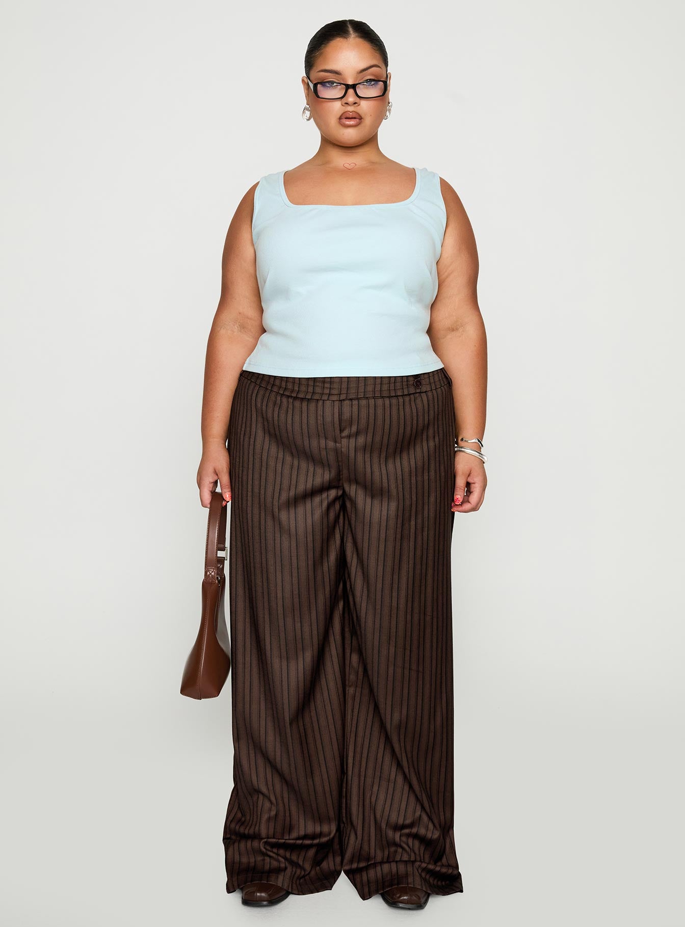 back view of model wearing Princess Polly Cedars Low Rise Pant Brown Stripe Curve Low Rise Pants 