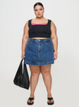 front view of model wearing Princess Polly Gazelle Denim Skort Mid Wash Curve High Waisted Shorts 