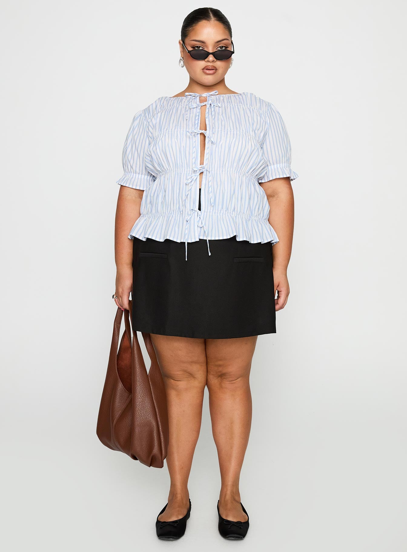 front view of model wearing Princess Polly Alistair Bow Tie Top Blue / White Stripe Curve Half Sleeves Crew Neck 