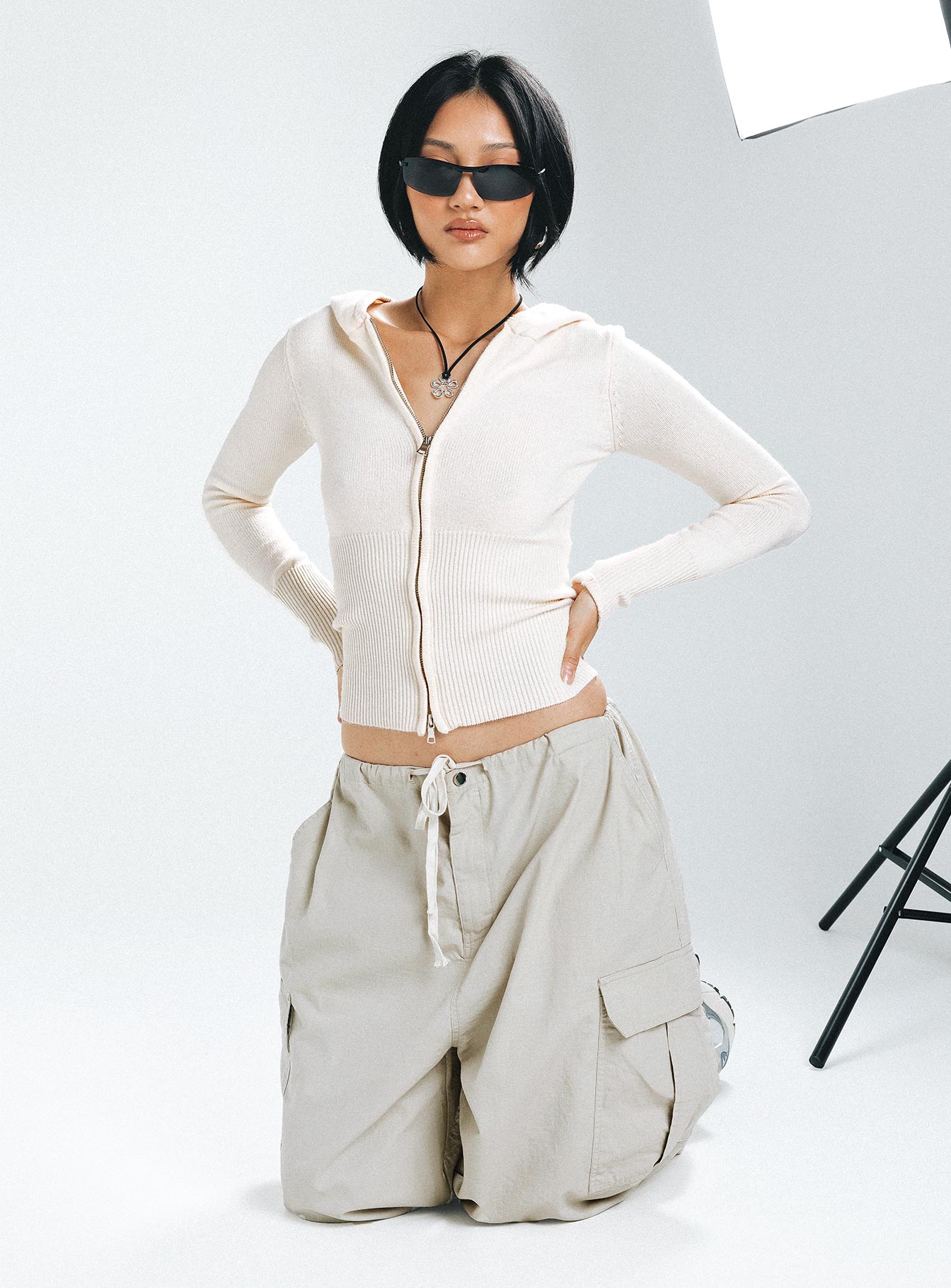 front view of model wearing Princess Polly Elingford Zip Up Hooded Sweater Cream 