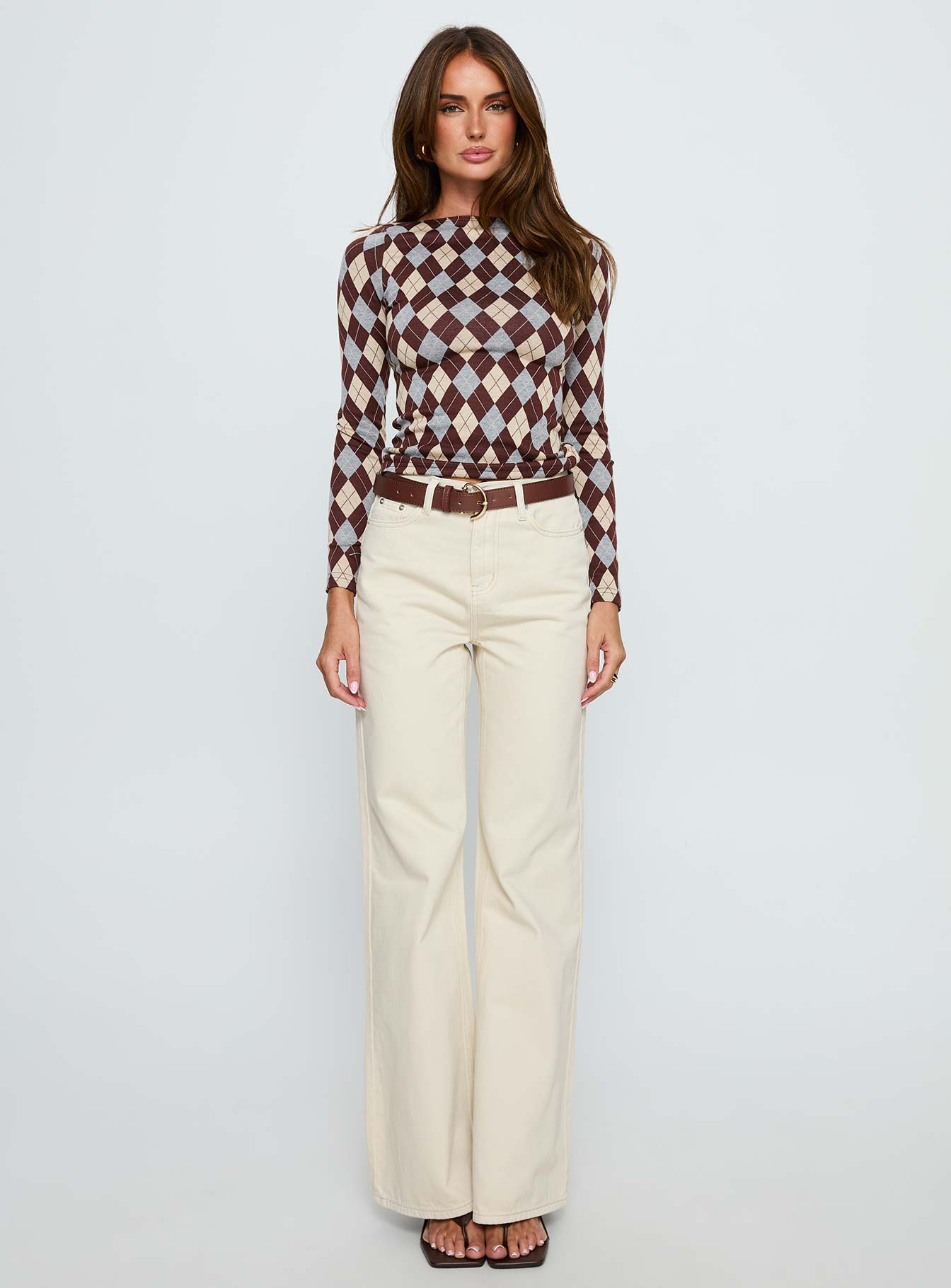 front view of model wearing Princess Polly Maple Mid Rise Flare Jeans Ecru High Rise Jeans 