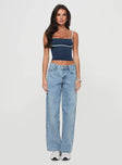 side view of model wearing Princess Polly Serenitia Mid Rise Relaxed Jeans Light Wash Petite Mid Rise 