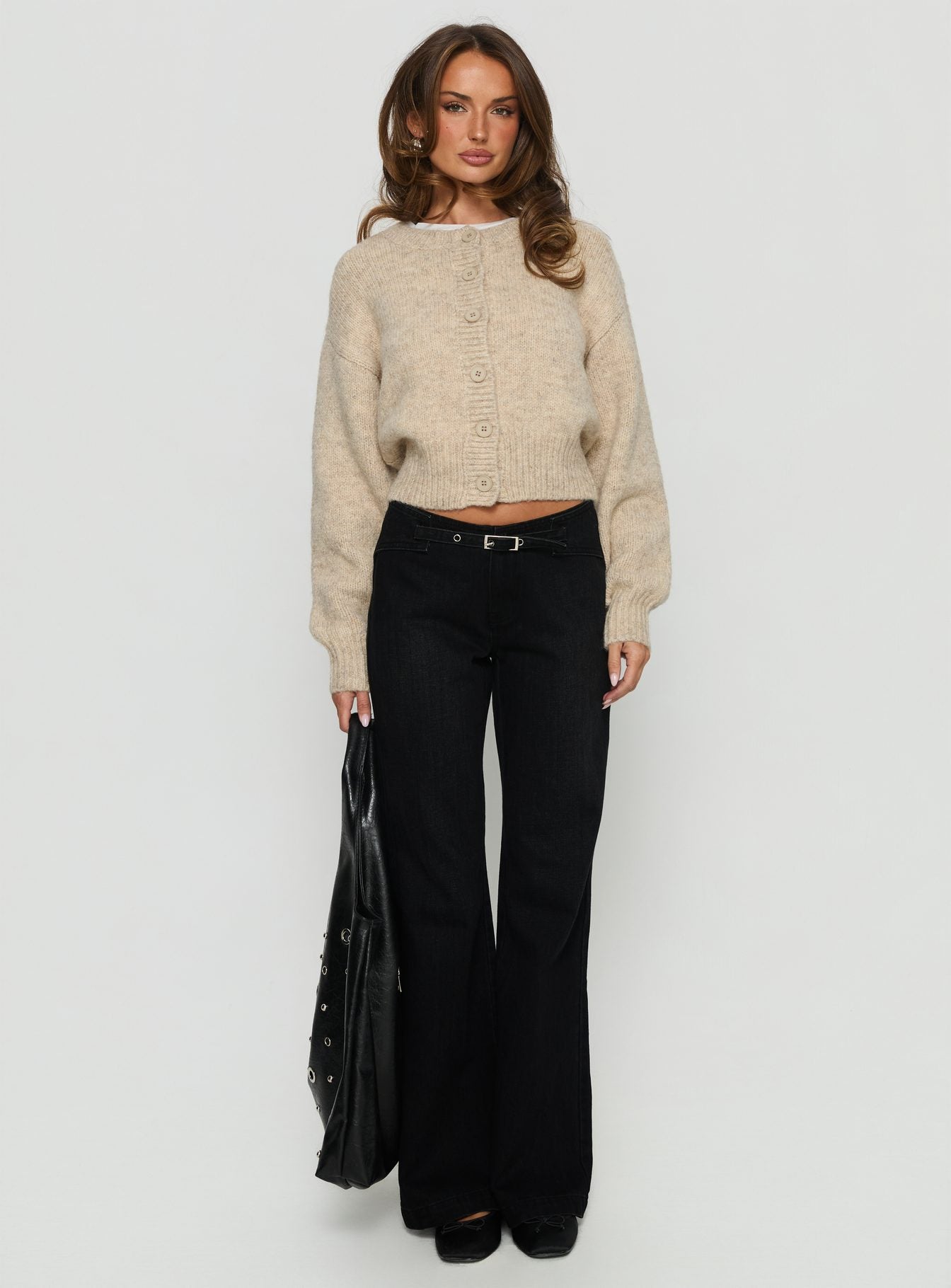 front view of model wearing Princess Polly Slow Ride Mid Rise Bootleg Belted Jeans Washed Black Mid Rise Jeans 