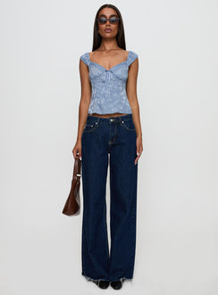 front view of model wearing Princess Polly Branwen Cap Sleeve Tie Detail Top Blue Floral Sleeveless Sweetheart 